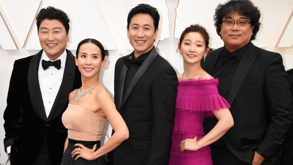 Director Bong Joon-ho (R) with cast and crew of "Parasite" attend the 92nd Annual Academy Awards at Hollywood and Highland on February 09, 2020 in Hollywood, California.