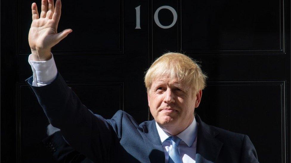 File photo dated 24/07/19 of new Prime Minister Boris Johnson waving outside 10 Downing Street,