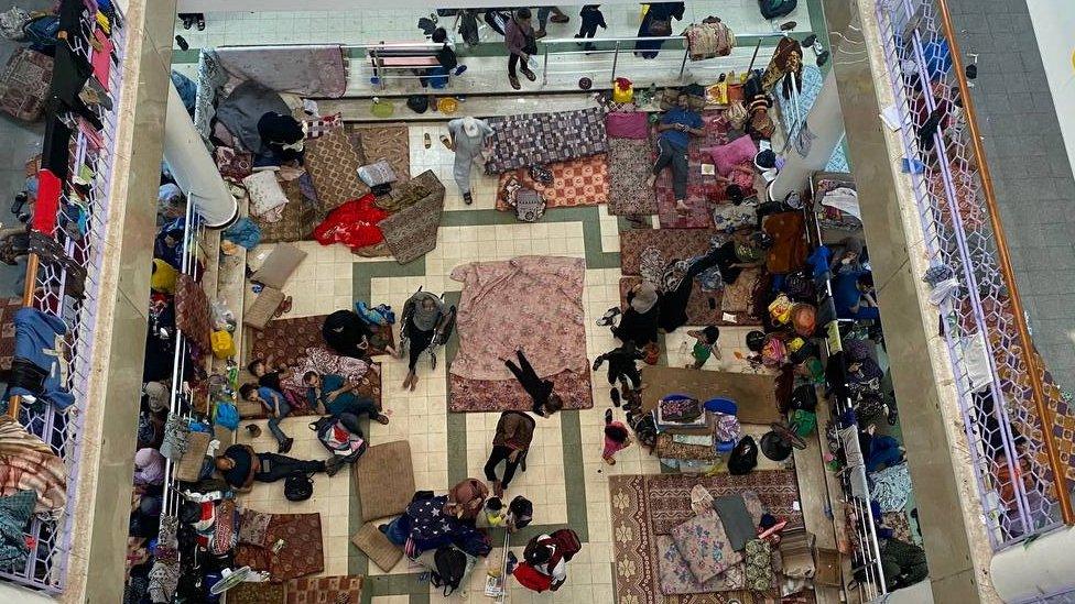 Refugees taking shelter in Rantisi hospital before its evacuation on Friday