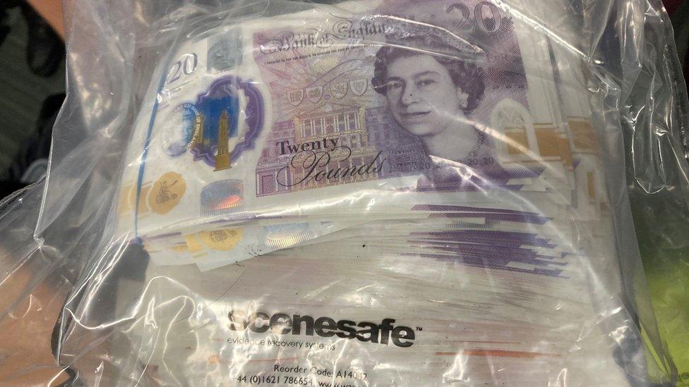 Cash seized in an evidence bag