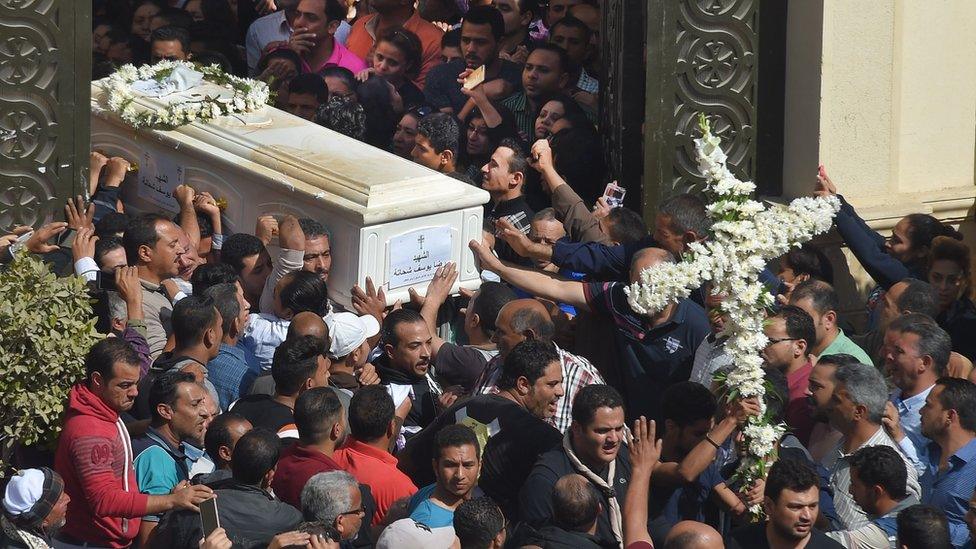 Coptic Christians carry the coffins of victims killed in an attack a day earlier, following a morning ceremony at the Prince Tadros church in Egypt"s southern Minya province, on November 3, 2018