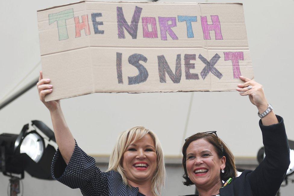 Sinn Féin's Michelle O Neill and Mary Lou McDonald hold placard saying 'The north is next'