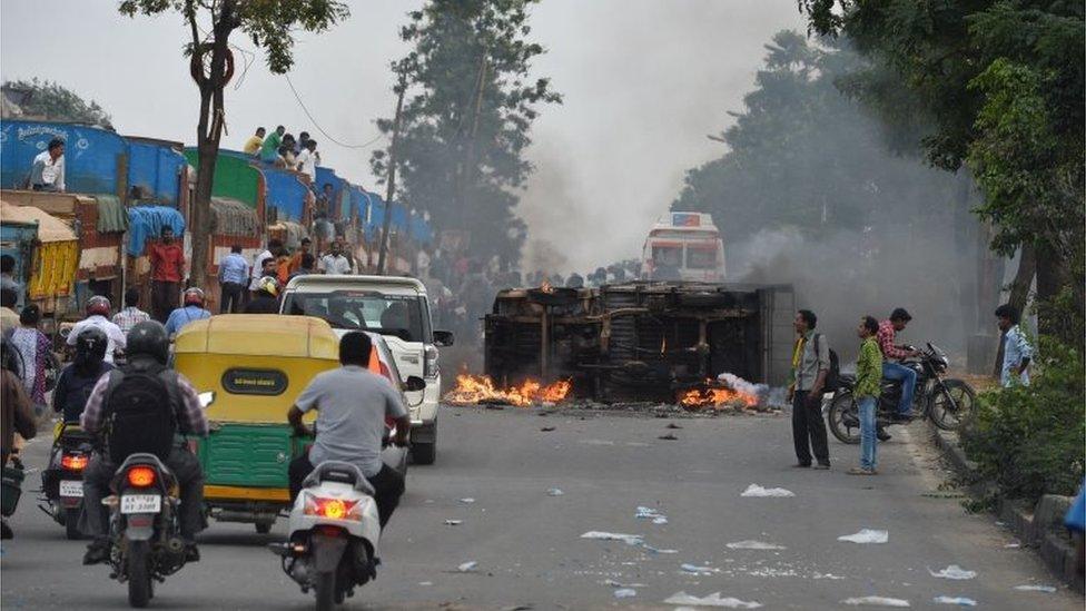 A truck belonging to the neighbouring state Tamil Nadu burns after it was set on fire by agitated pro-Karnataka activists as the Cauvery water dispute erupted into violence following the Supreme Court"s order to release water to Tamil Nadu, in Bangalore on September 12, 2016.