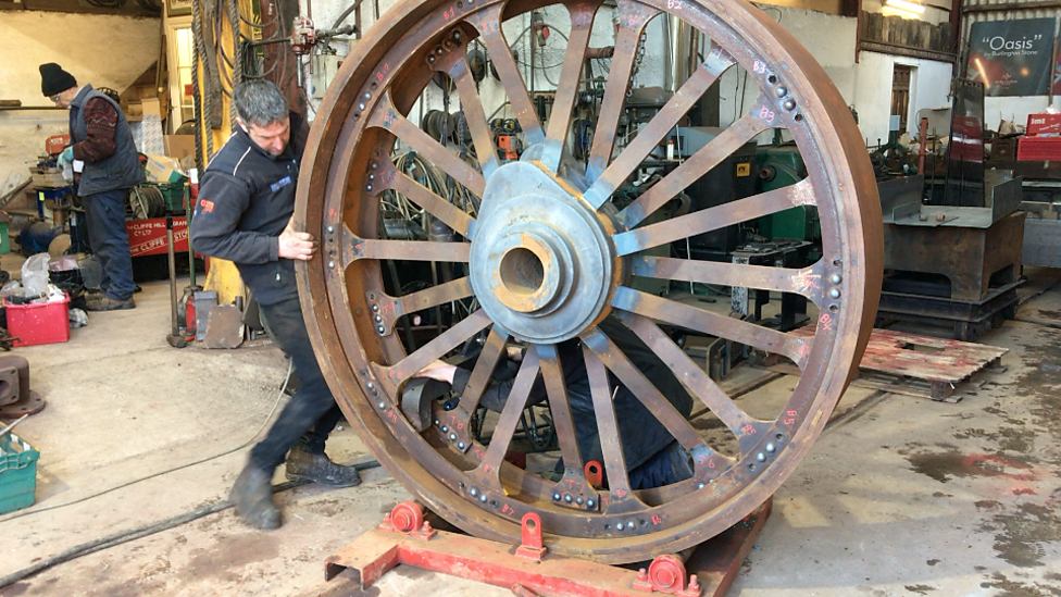 Alex Sharphouse with one of Talisman's rear wheels.