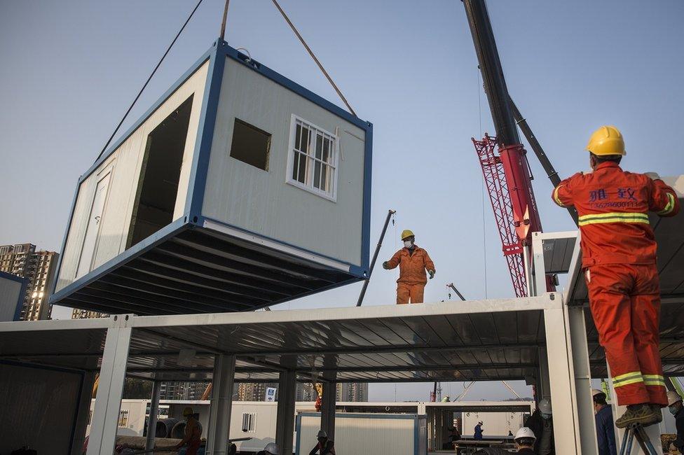 A prefabricated building is lowered at Huoshenshan Hospital