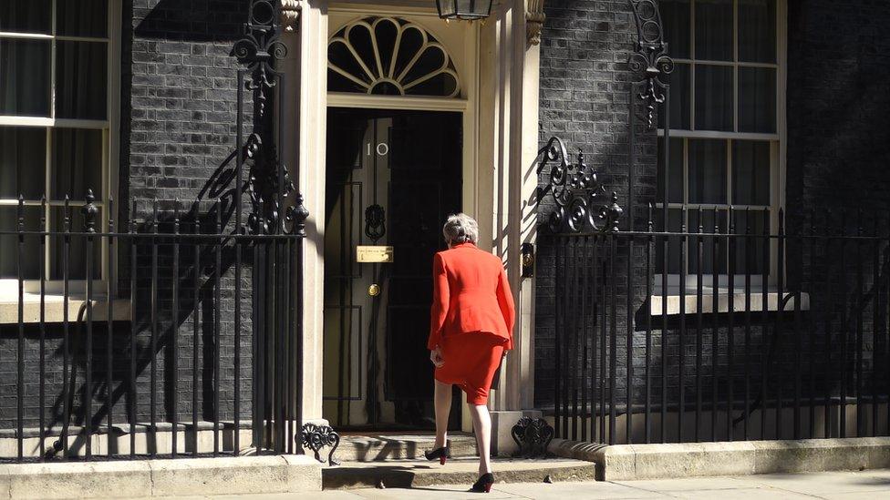 Theresa May walking back into Downing Street