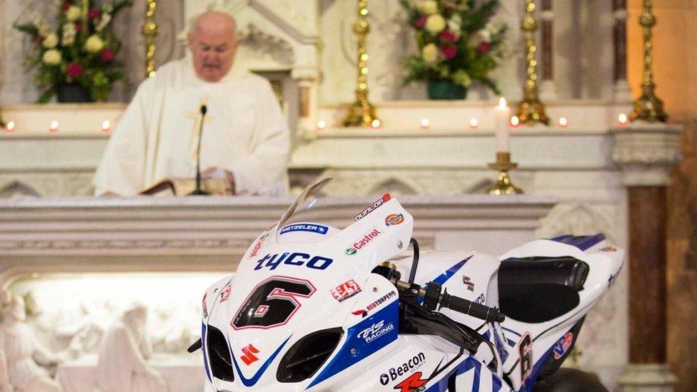 Fr Kearns at the 2019 memorial which featured a race bike belonging to the late William Dunlop