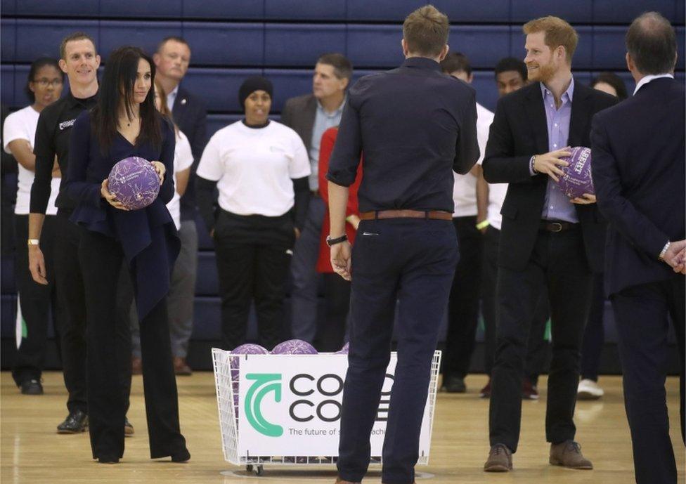 Meghan was seen listening intently before taking on her husband's team