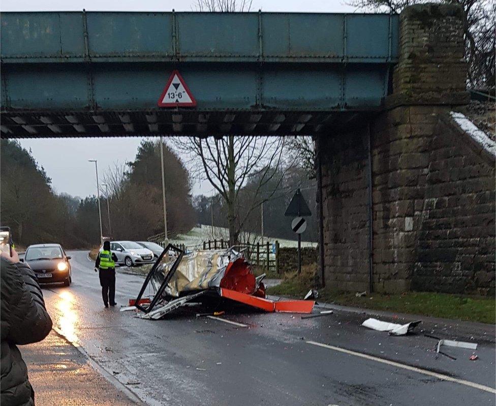 Bus roof debris on the floor under the railway bridge