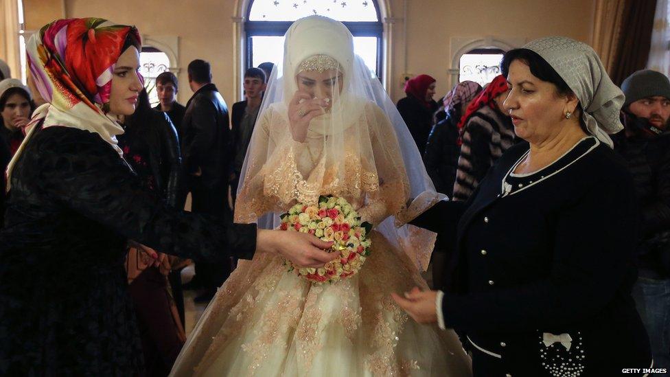 A Chechen bride with her family on the day of her wedding