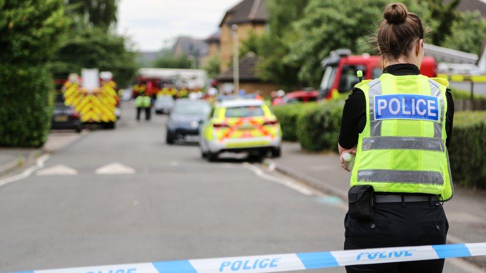 A police officer by a police cordon in Bedford