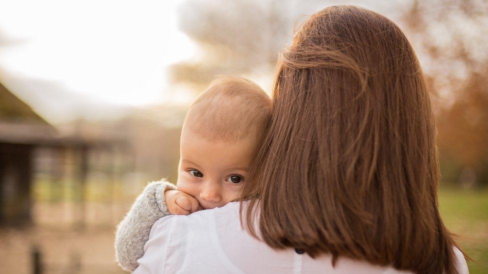 Woman holding baby