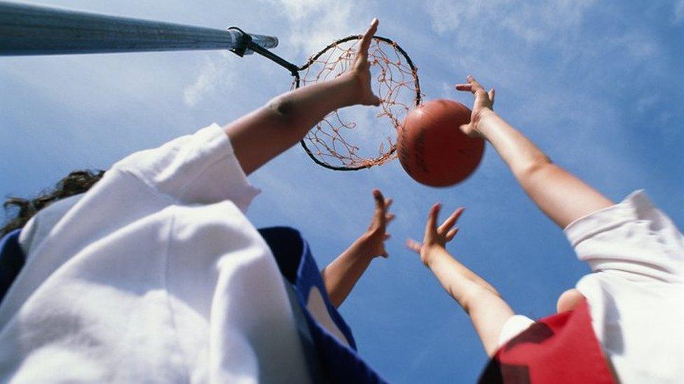 Girls playing netball