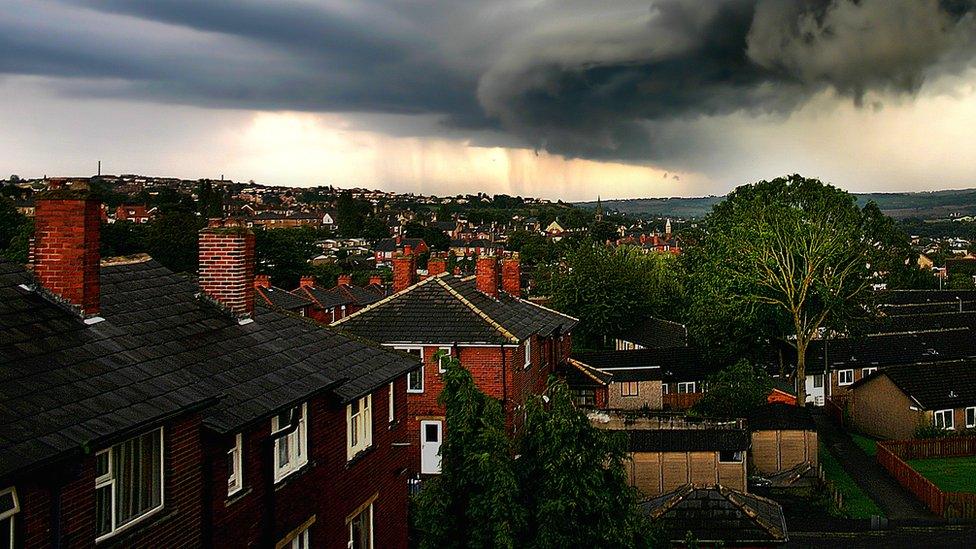 Houses with storm couds