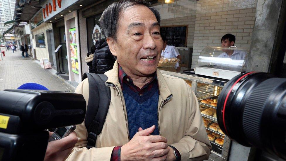 Bookseller Lee Bo speaks to media near his home in Hong Kong Friday, March 25, 2016