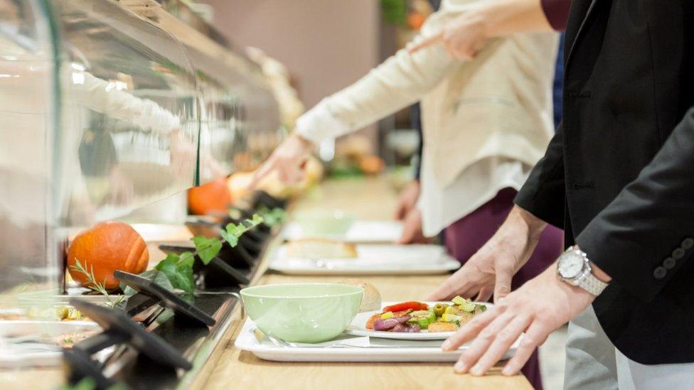 Person queuing up with food