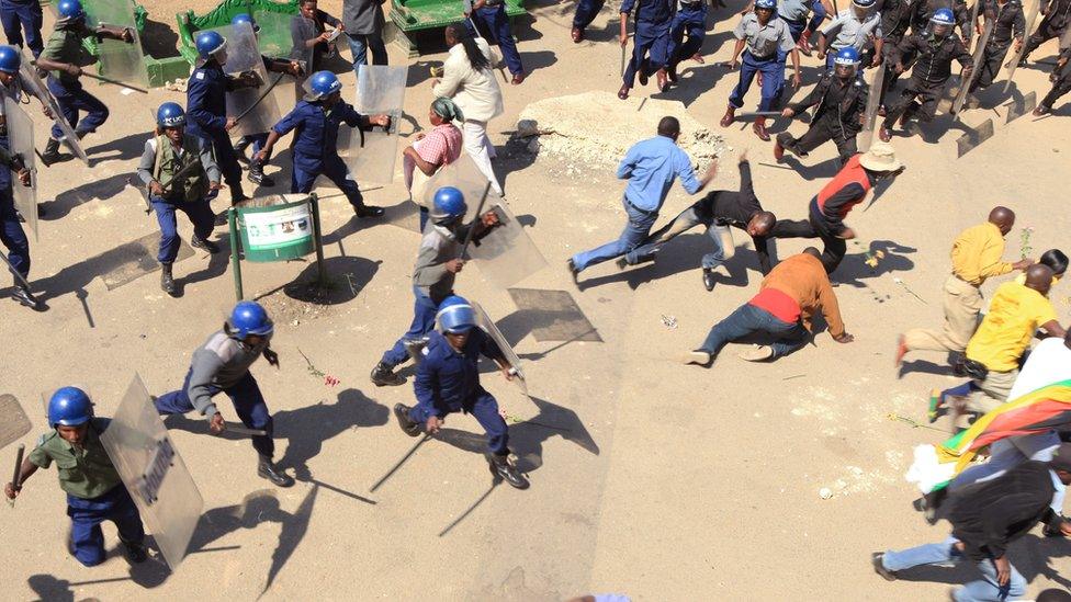 From a serene night to clashes in Zimbabwe's capital, Harare where police disperse protestors during a demo against bond notes but one woman stands her ground.