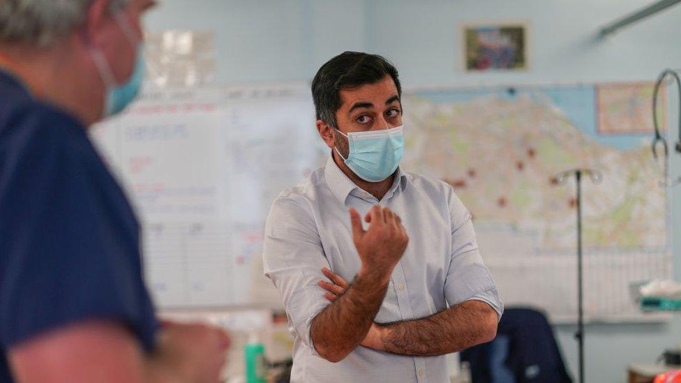 Humza Yousaf talks to staff during a visit to Liberton Hospital in Edinburgh