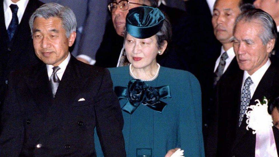 Japanese Emperor Akihito (L), Empress Michiko (C) and Prime Minister Tomiichi Murayama (L) arrive at the national theater 18 December to attend the ceremony to commemorate the 50th anniversary of the end of the World War II.