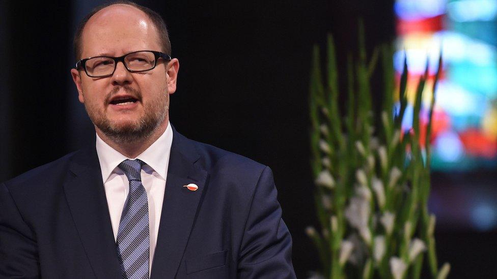 Picture taken on May 5, 2016 shows the mayor of Gdansk Pawel Adamowicz giving a speech during a commemorative ceremony at the St Petri Dom cathedral in Bremen, northwestern Germany.