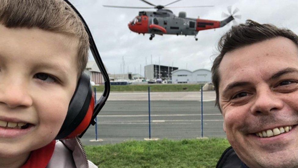 Finley Eckersley and dad with Sea King helicopter