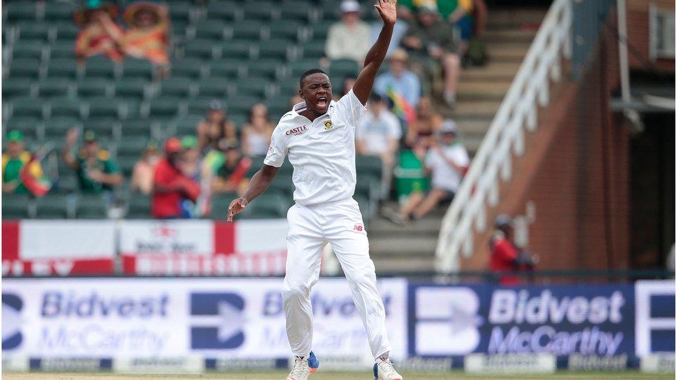 South African bowler Kagiso Rabada (R) celebrates the dismissal of England's batsman Joe Root (not pictured) during day 3 of the third Test match between England and South Africa at Wanderers stadium on January 16, 2016