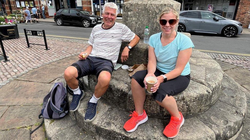 Mike Farnham and daughter Caroline Farnham-Crossland sitting in Market Place, Howden