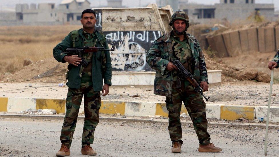 Kurdish Peshmerga forces in the town of Sinjar