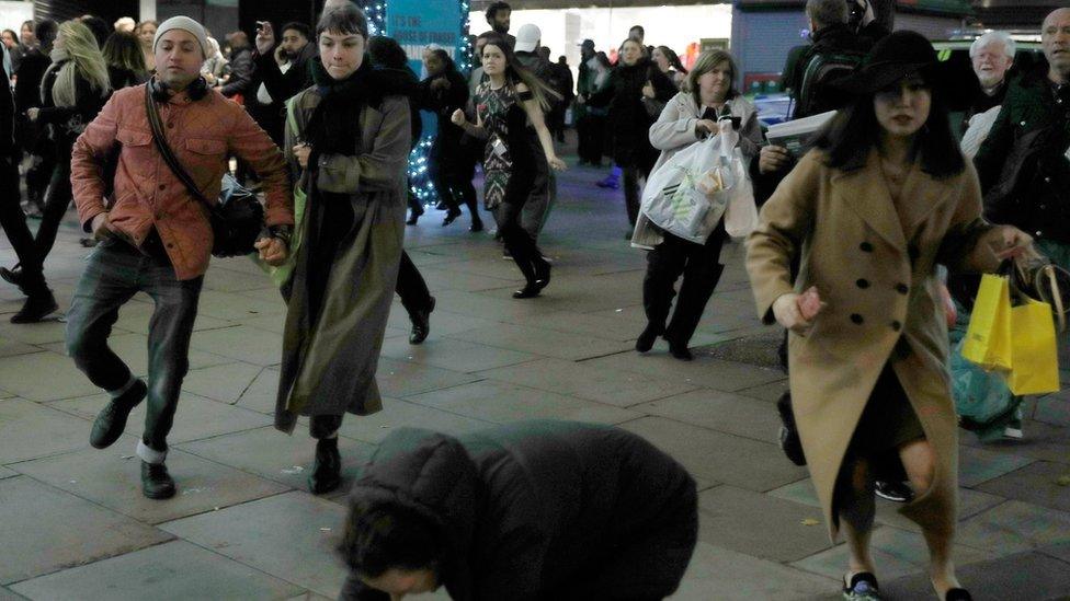 People fleeing the station