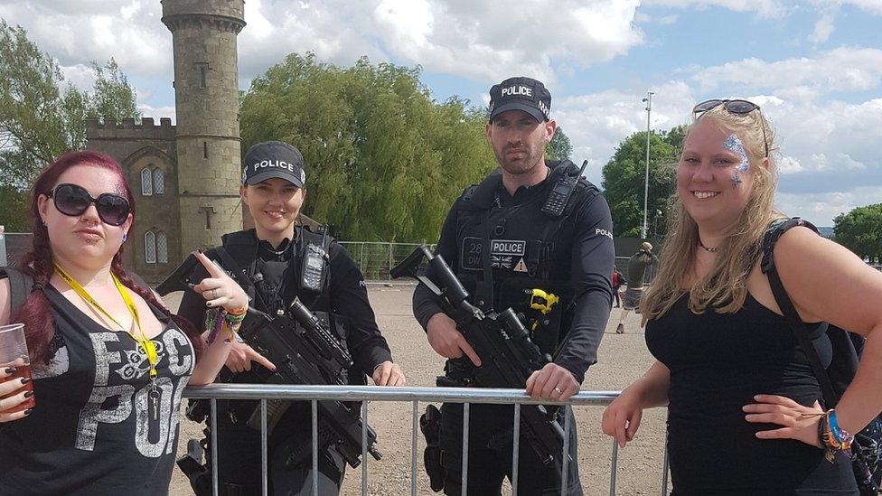 Fans with two armed officers