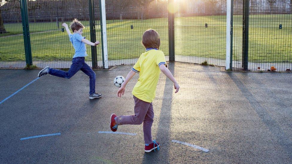 Children playing football