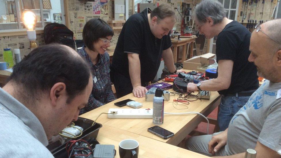 People take part in a repair event