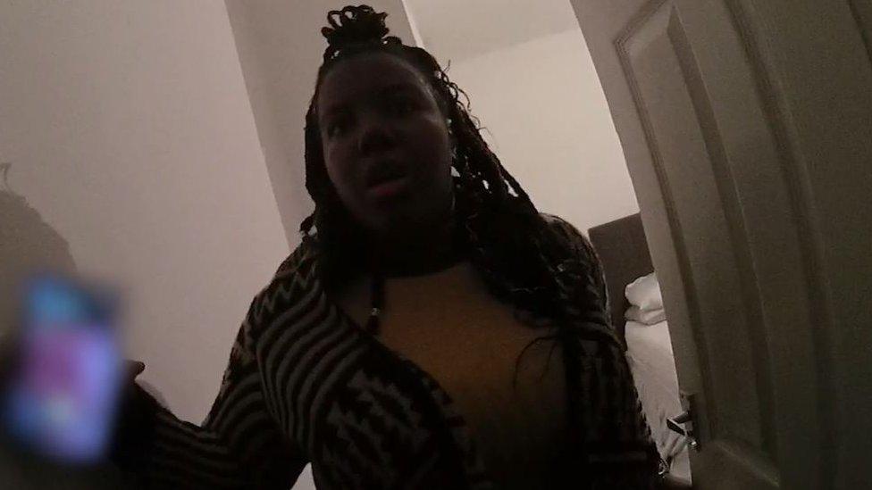 Police bodycam footage of the murder-accused woman in a bedroom