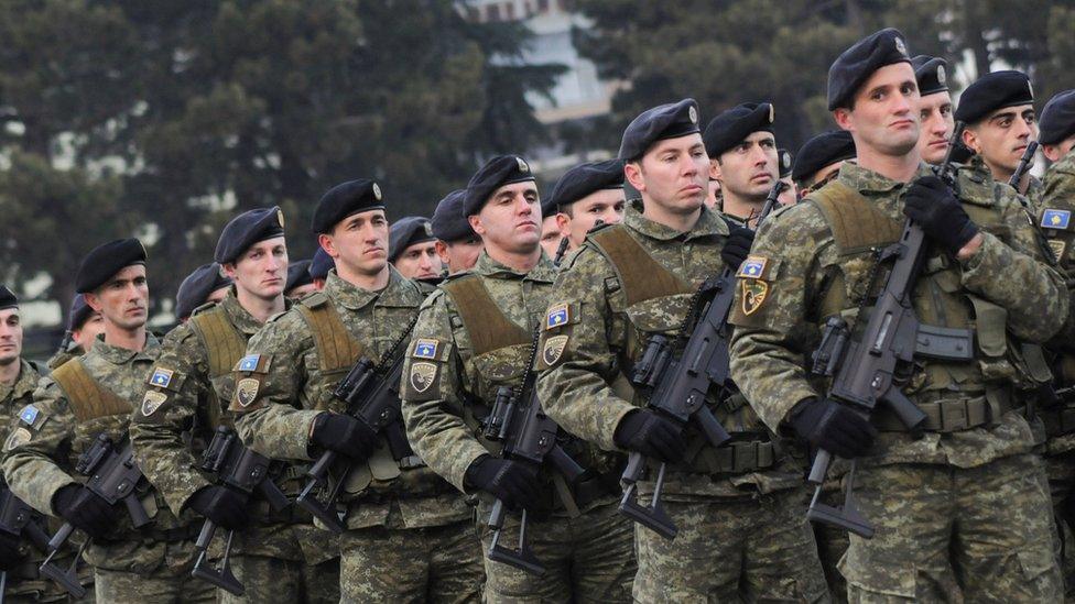 Members of Kosovo's security forces parade a day before parliament's vote on whether to form a national army, in Pristina, Kosovo, December 13, 2018