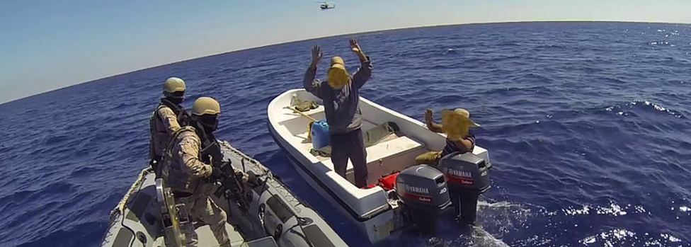 A Spanish force boards a boat off Libya