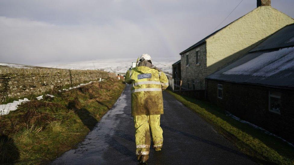 An engineer helps to restore power in a remote location