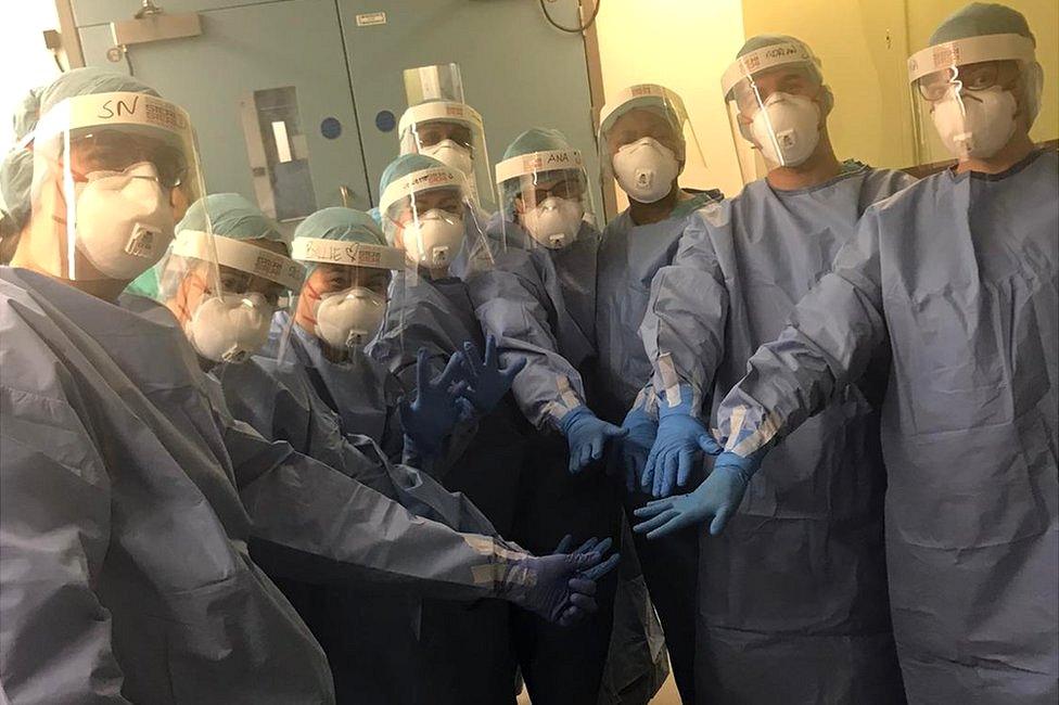 Nurses in protective equipment before the start of the shift