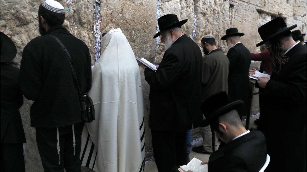 Orthodox Jews gather at the Western Wall in the Old City of Jerusalem on 28 December 2017, to pray for rain.