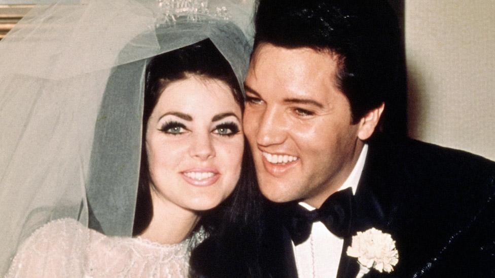 Elvis Presley sits cheek to cheek wit his bride, the former Priscilla Ann Beaulieu, following their wedding May 1, 1967.