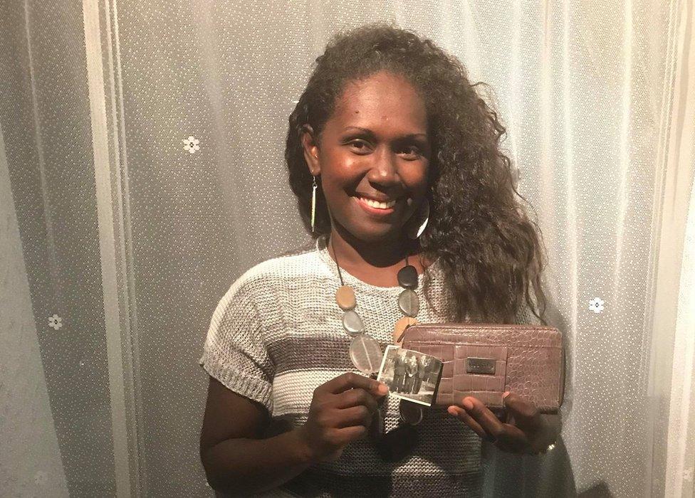 Lalen with her photo and purse