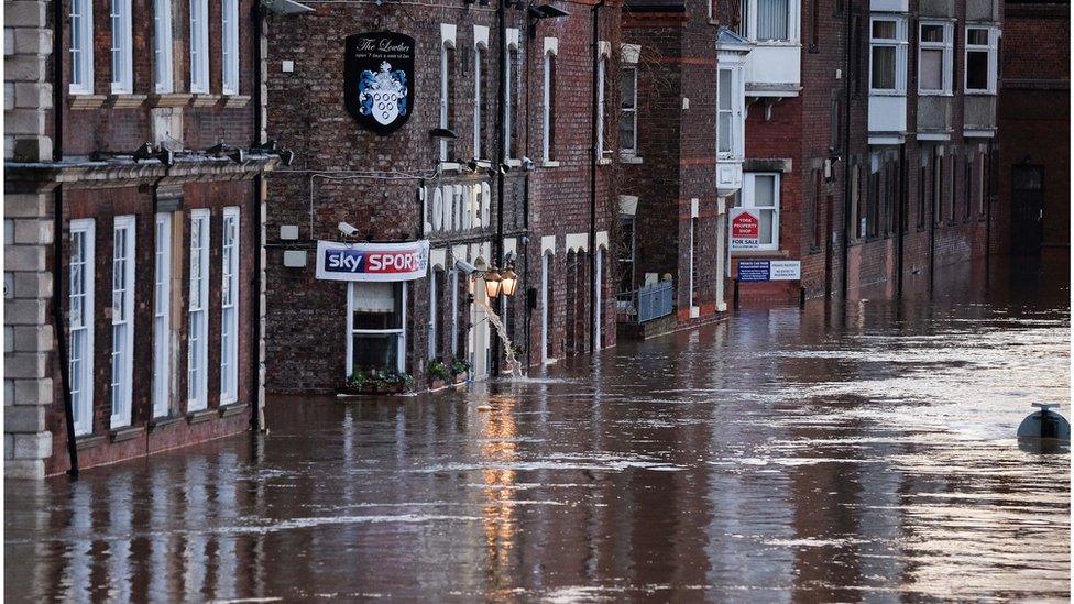 Flooding of riverside businesses near the River Ouse in York