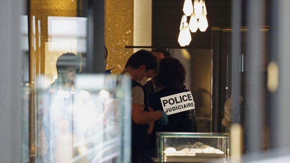 The robbers grabbed luxury items from the store's display cases