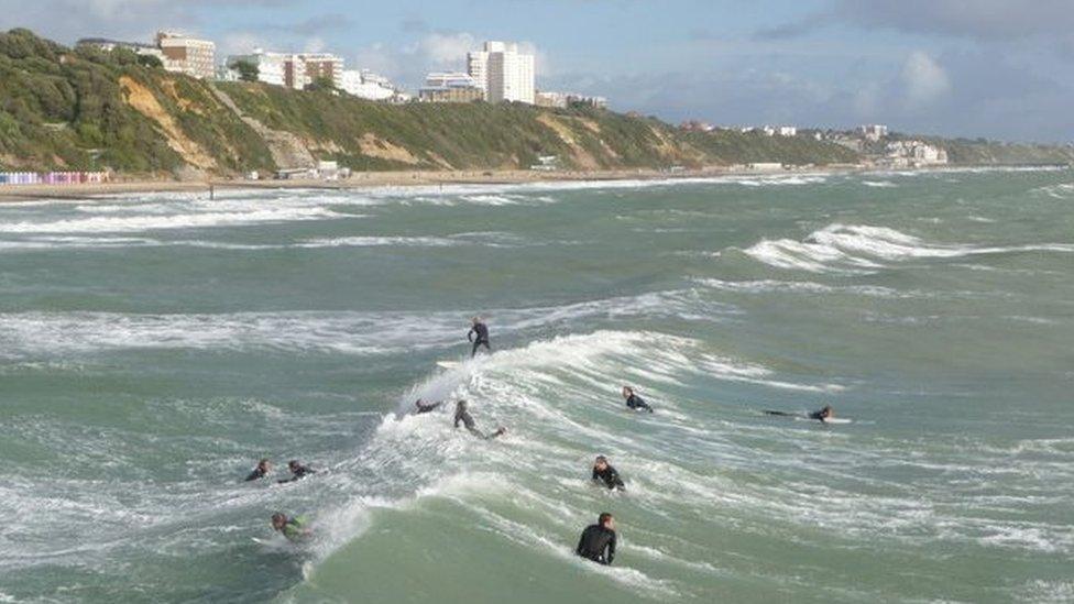 Surfers in the sea at Bournemouth