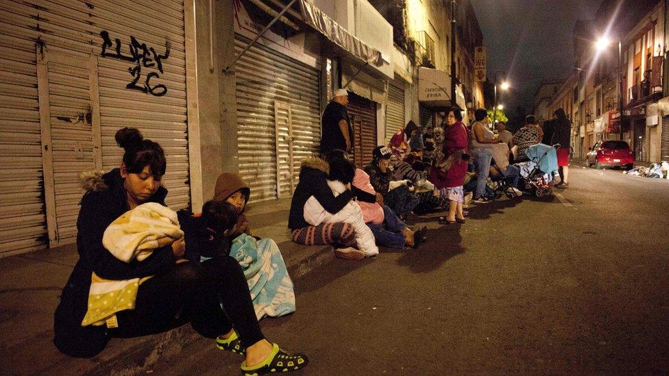 People sitting outside on street