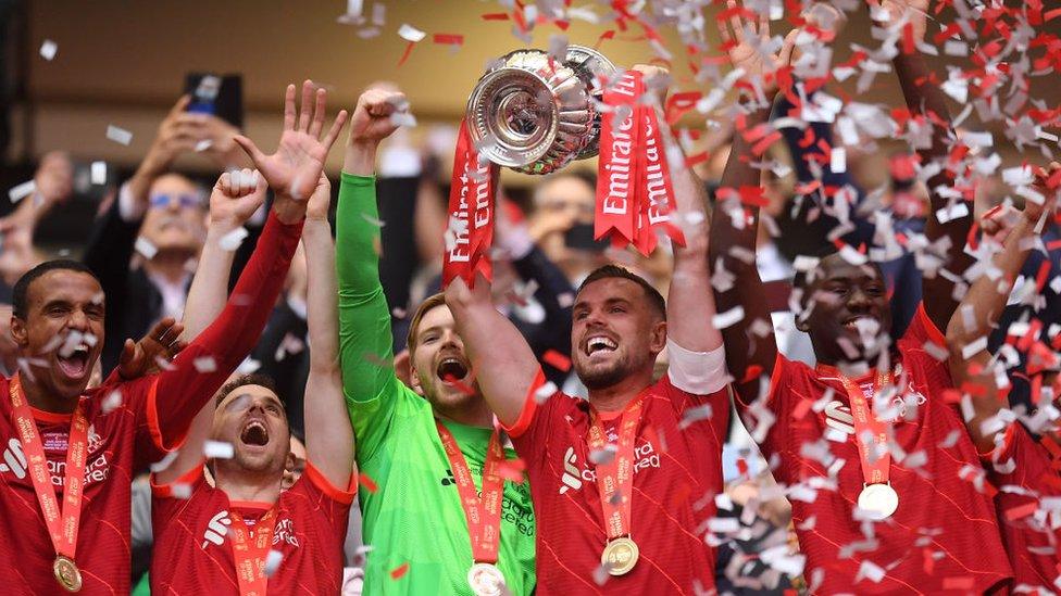 Liverpool lifting the FA Cup trophy