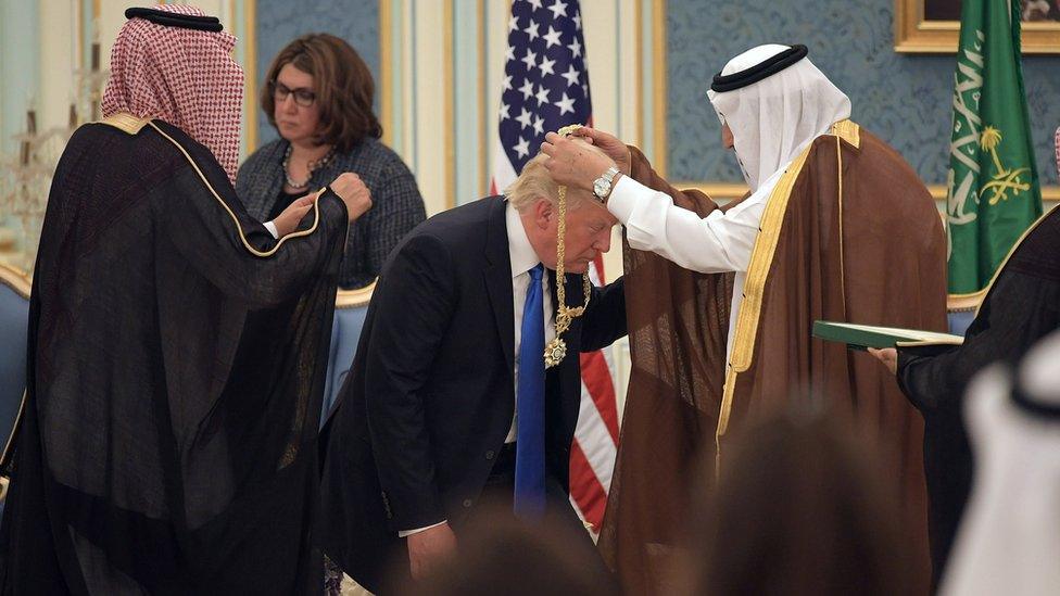 US President Donald Trump receives the Order of Abdulaziz al Saud medal from Saudi Arabia's King Salman bin Abdulaziz Al Saud