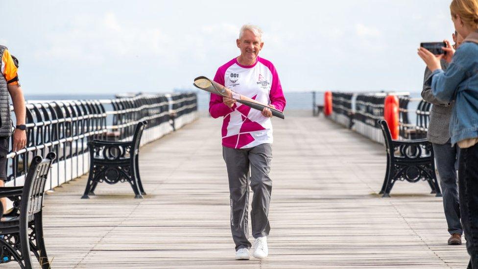 Philip Holbrook takes part in the Queen's Baton Relay as it visits Saltburn