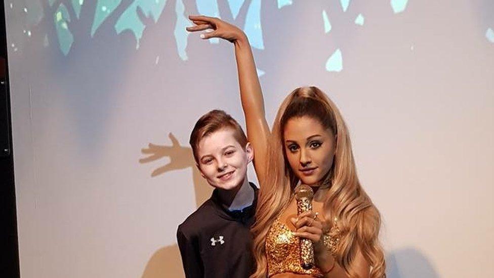 Ciaran with a waxwork of Ariana Grande