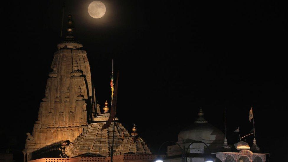 Buck Moon appearing in the sky over the Laxminarayan temple in Jaipur in India