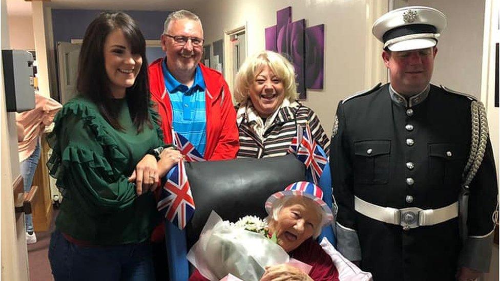 Lily, pictured (from left to right) with nurse Emma Ewart, son-in-law Brian and daughter Lily, was delighted that Mark Gamble presented her with flowers